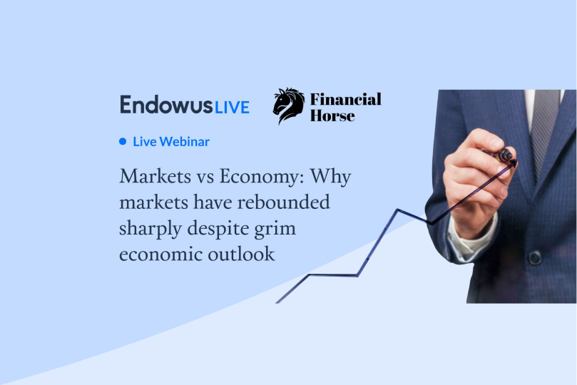 suited man writing with marker